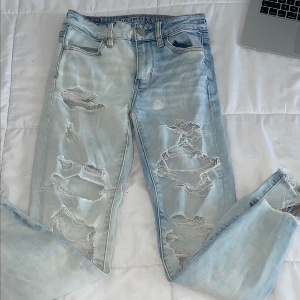 ripped skinny jeans one side darker than other